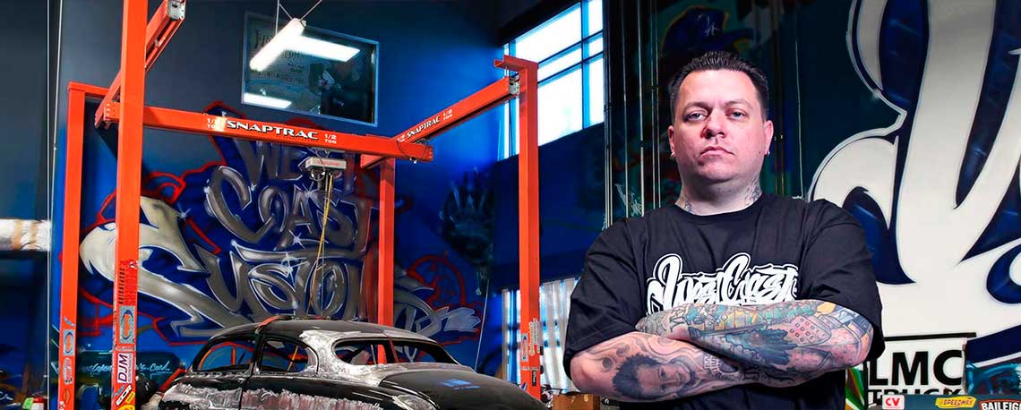 Photograph of West Coast Customs Worker posing with his Snaptrac